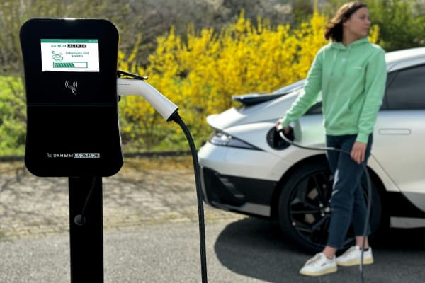 person charging ev car