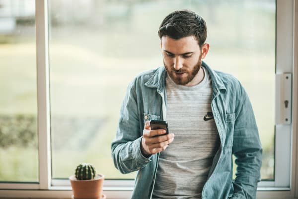 man looking at phone
